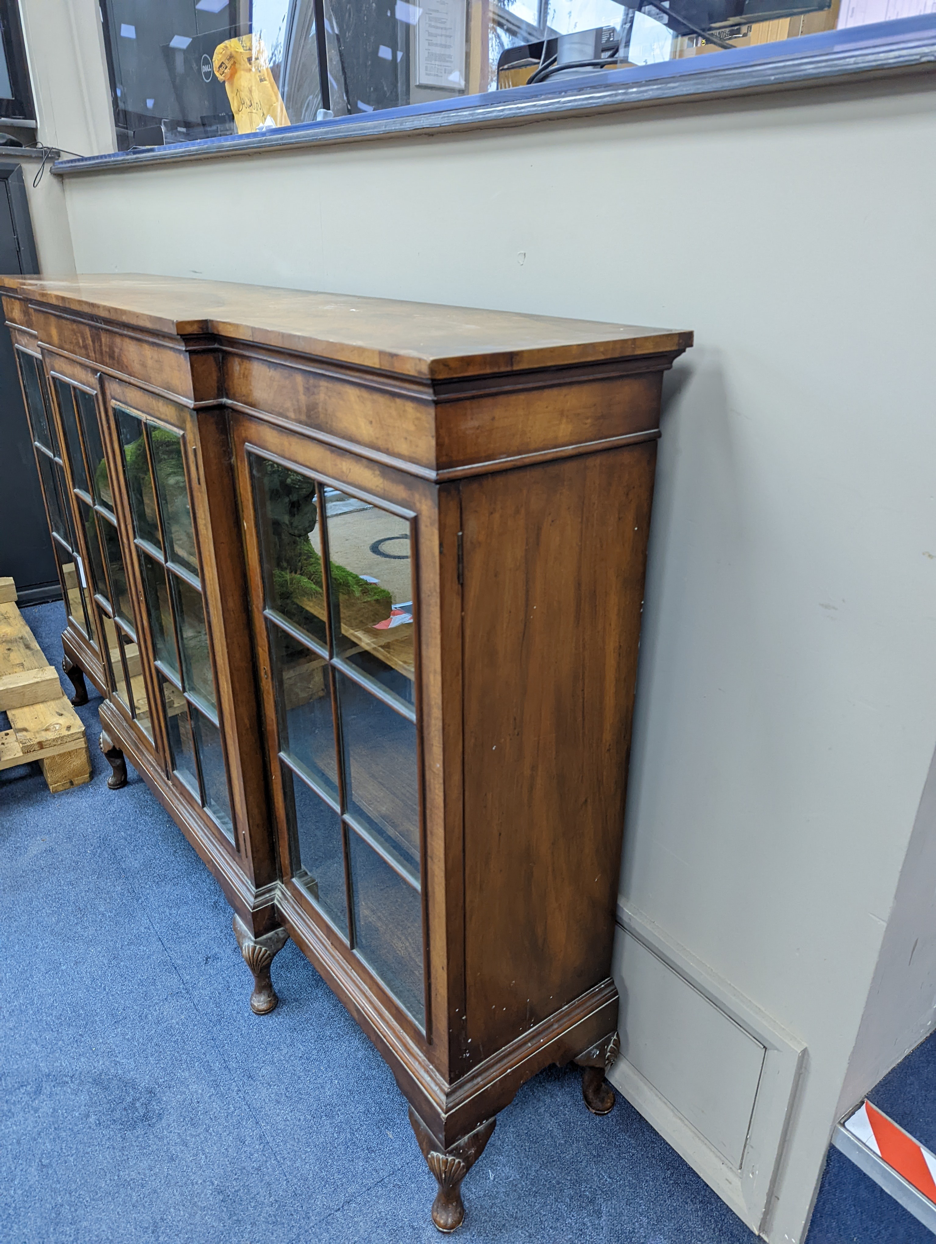 A Queen Anne revival walnut dwarf breakfront bookcase, length 182cm, depth 38cm, height 113cm